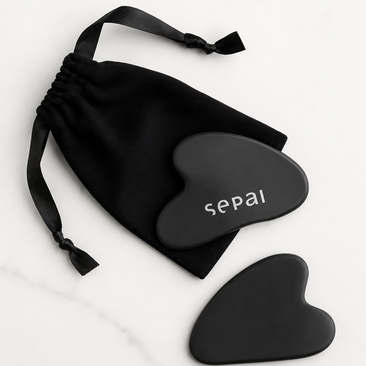 Gua sha en pierre noir